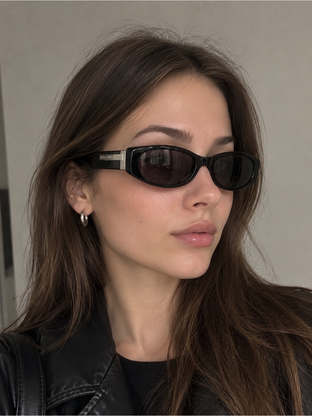 Nina Ricci Black Slim Oval Sunglasses with Silver Accents